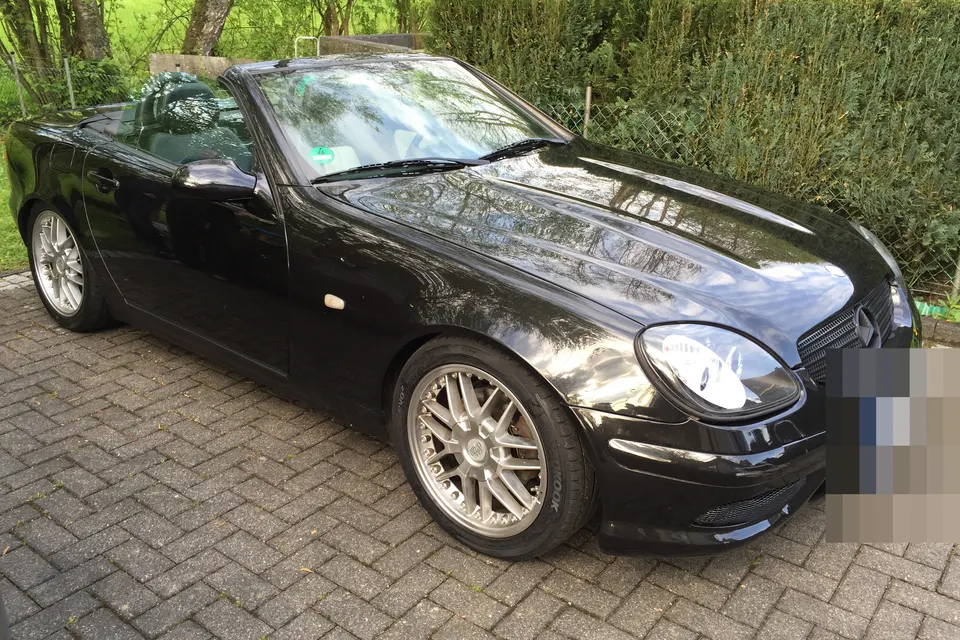 Black first-generation Mercedes-Benz SLK R170, front three-quarter view