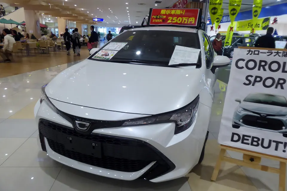 White Toyota Corolla Sport hatchback, front three-quarter view