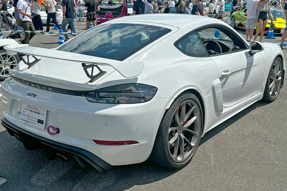White Porsche 718 Cayman GT4 RS Type 982 photographed from the rear three-quarter angle at Supercar FES 2024