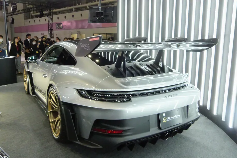 Grey Porsche 911 GT3 RS Type 992.1 photographed from the rear three-quarter angle at Japan Mobility Show Kansai 2025