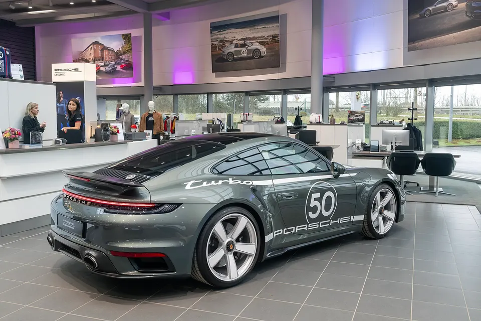 Grey Porsche 911 Turbo 50 Years Type 992.1, front three-quarter view