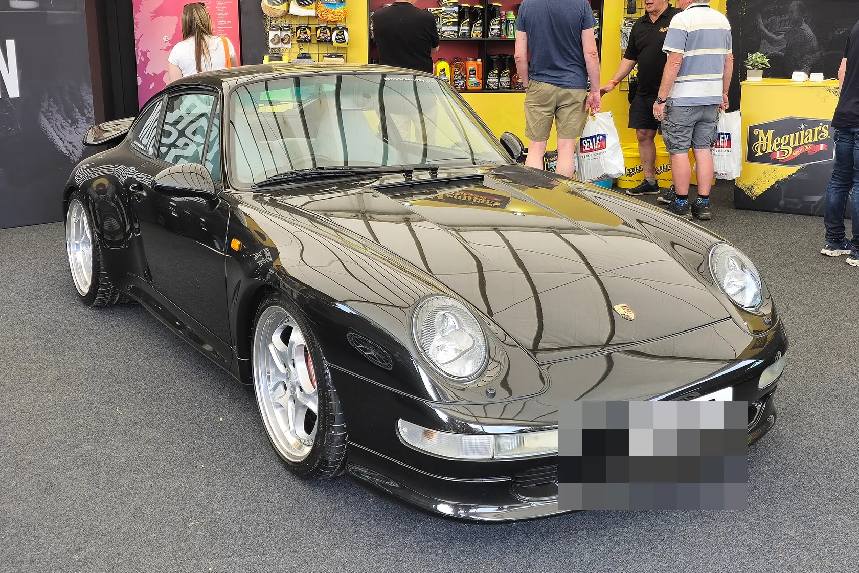 Black Porsche 911 Turbo Type 993, front three-quarter view
