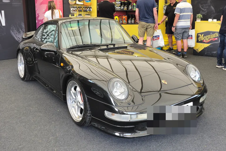 Black Porsche 911 Turbo Type 993, front three-quarter view