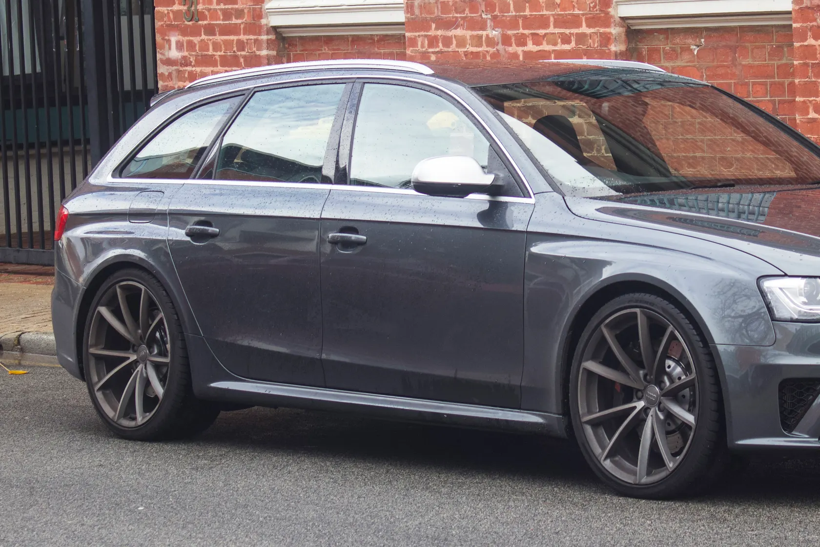 Grey Audi RS 4 Avant B8 in side-front view