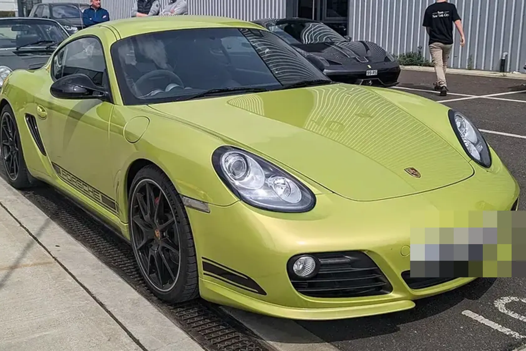 Green Porsche Cayman R, front three-quarter view