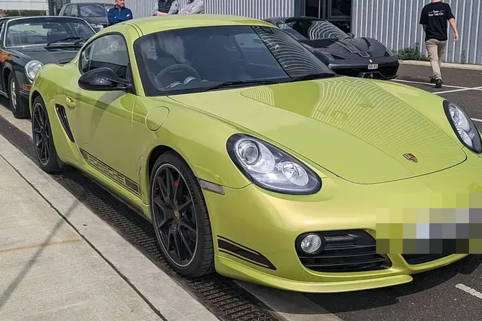 Green Porsche Cayman R, front three-quarter view