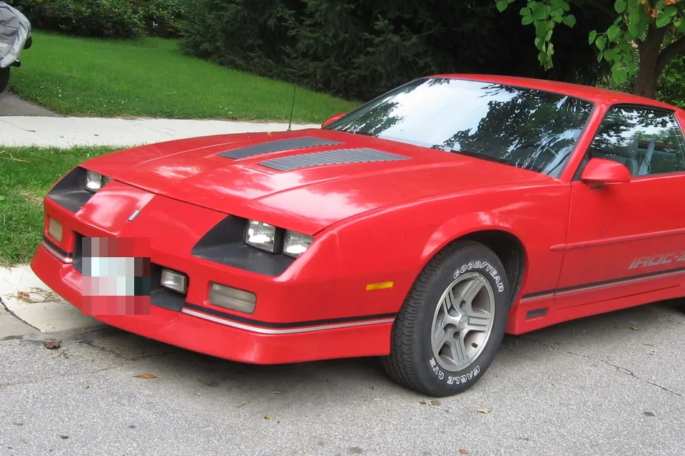 Red Chevrolet Camaro IROC-Z in front three-quarter view