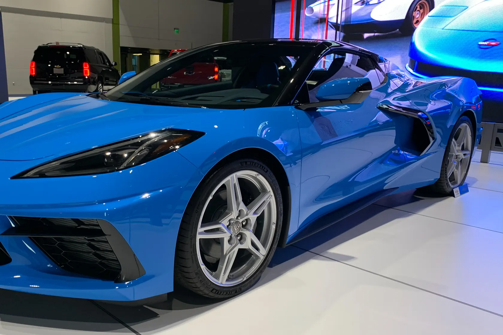 Blue 2020 Chevrolet Corvette C8 Stingray at an indoor motor show