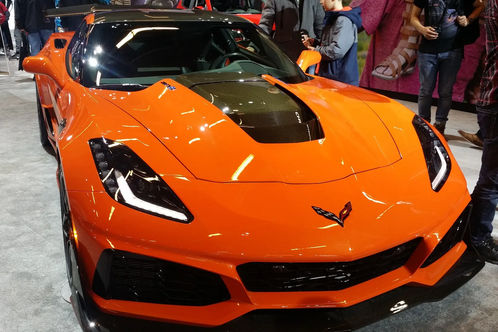 Orange 2019 Chevrolet Corvette C7 ZR1 at an indoor motor show