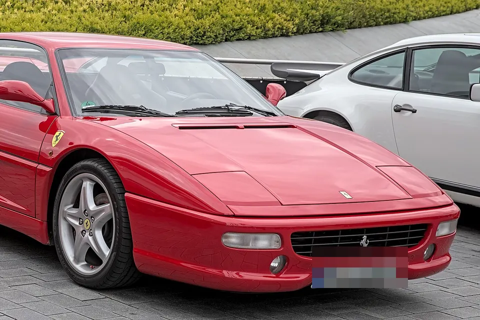 Red Ferrari F355 Berlinetta, front three-quarter view