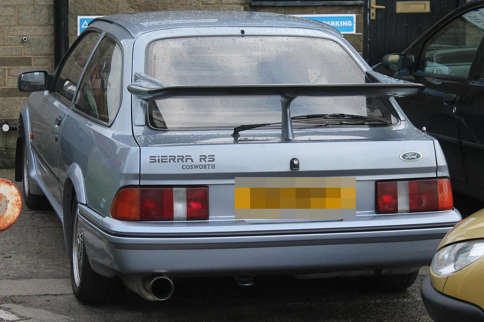 Blue 1986 Ford Sierra RS Cosworth in front three-quarter view