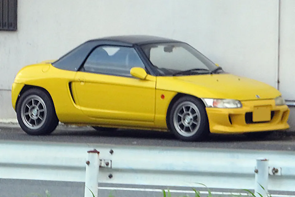 Yellow Honda Beat PP1 in right-side profile