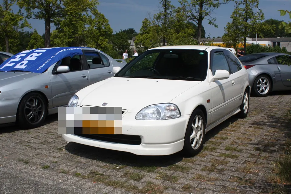 White Honda Civic Type R EK9 in front three-quarter view
