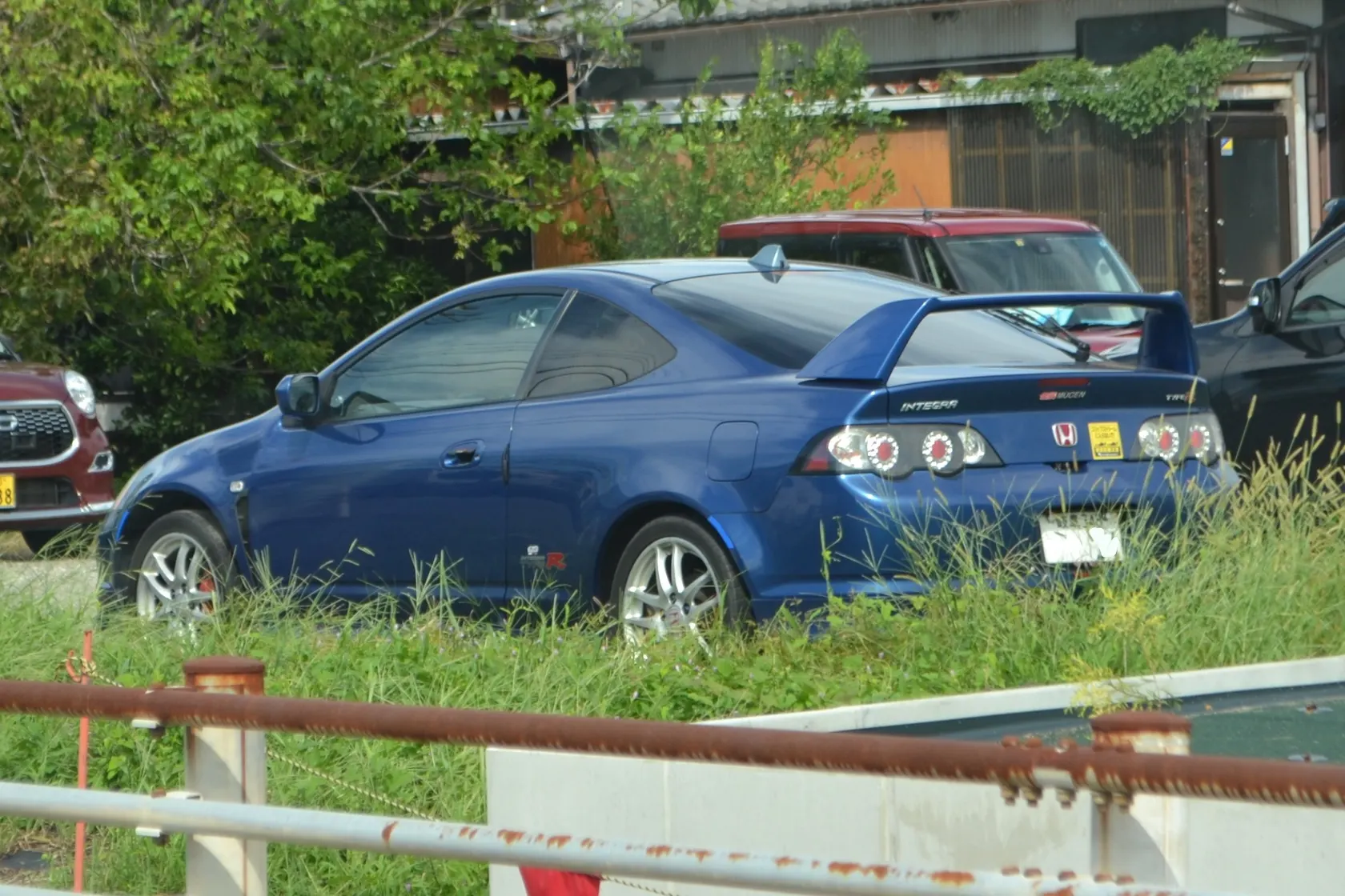 Blue Honda Integra Type R DC5 in rear three-quarter view