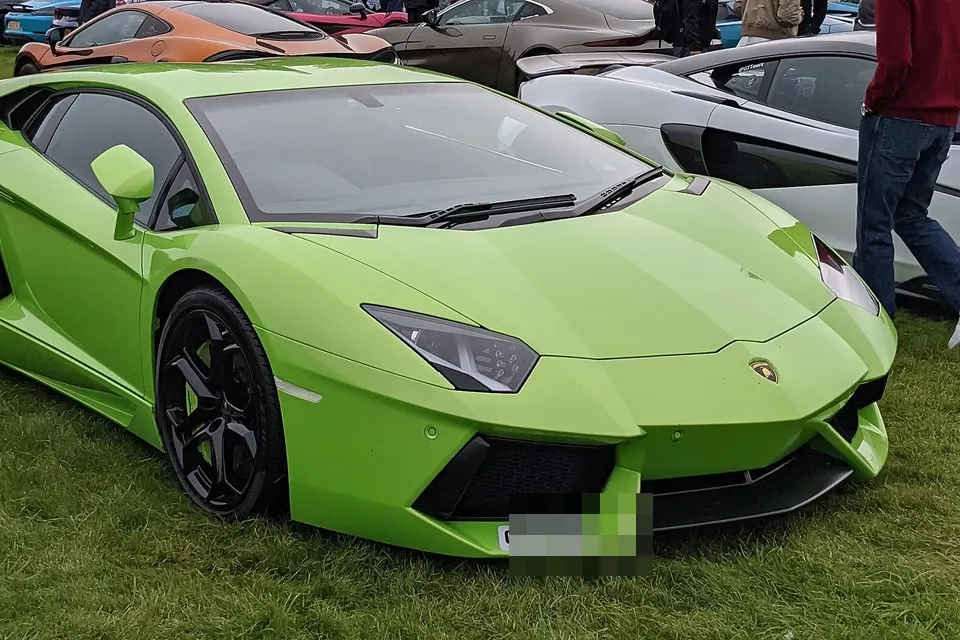 Orange Lamborghini Aventador LP 700-4 viewed from the front quarter