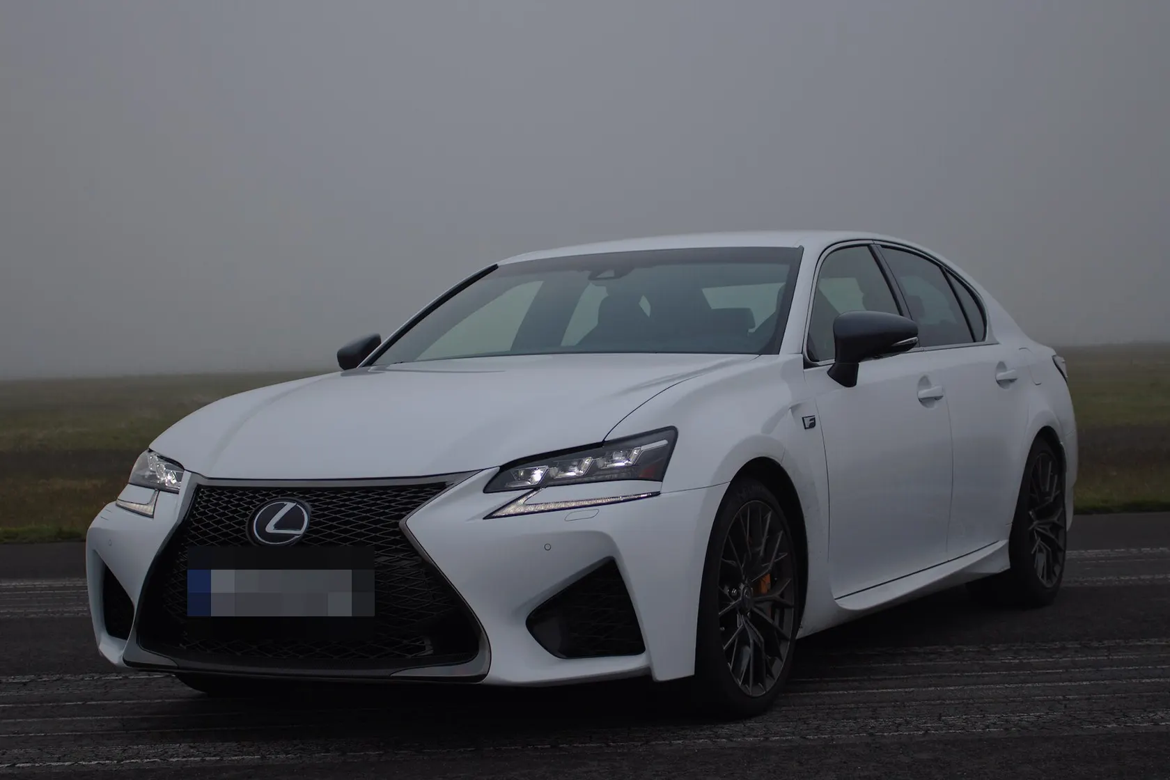 White Lexus GS F, front three-quarter view