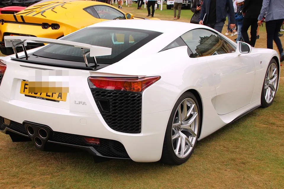 White Lexus LFA photographed from the rear three-quarter at a car event