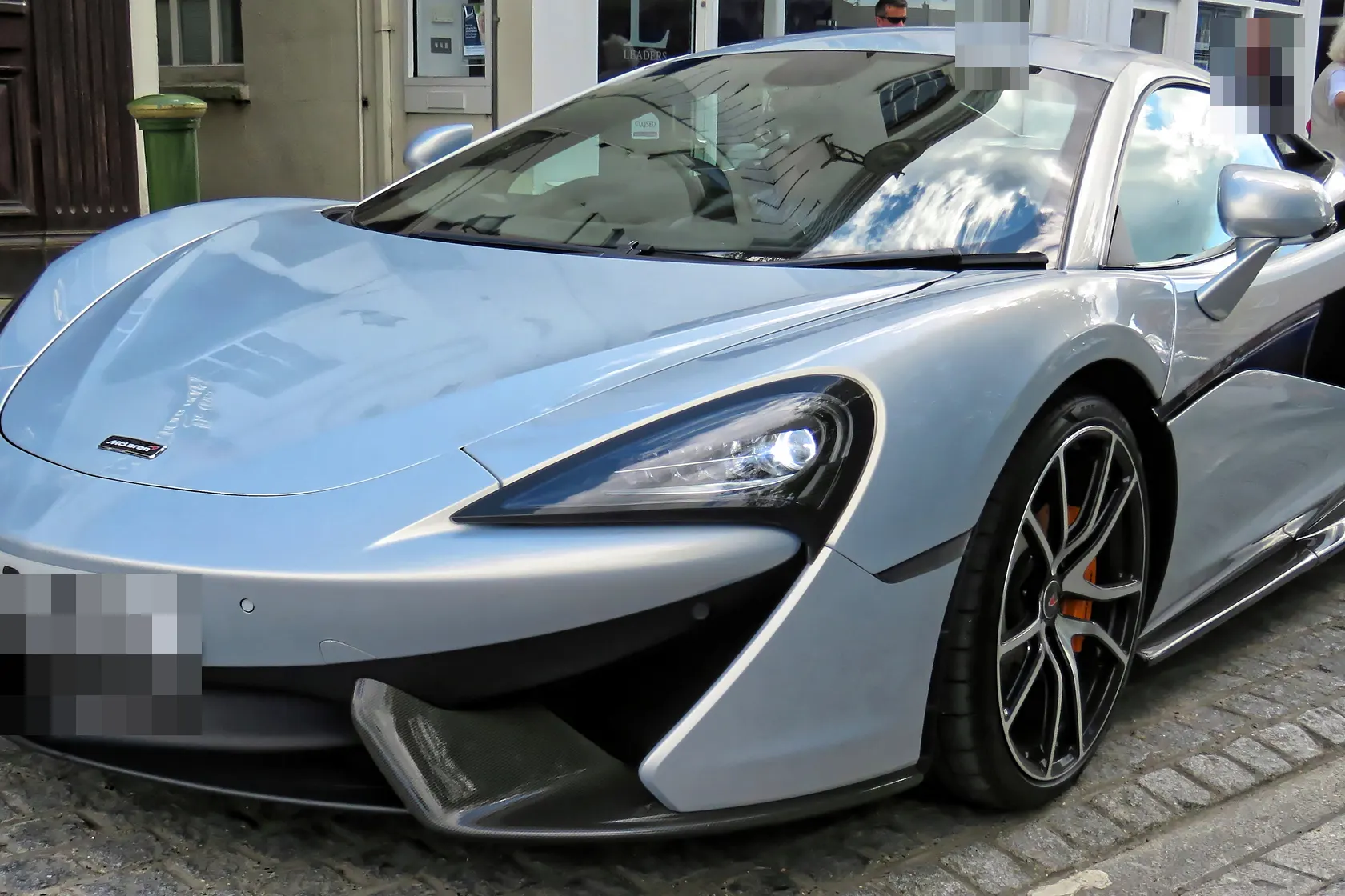 McLaren 570S Coupe at an outdoor event in front three-quarter view