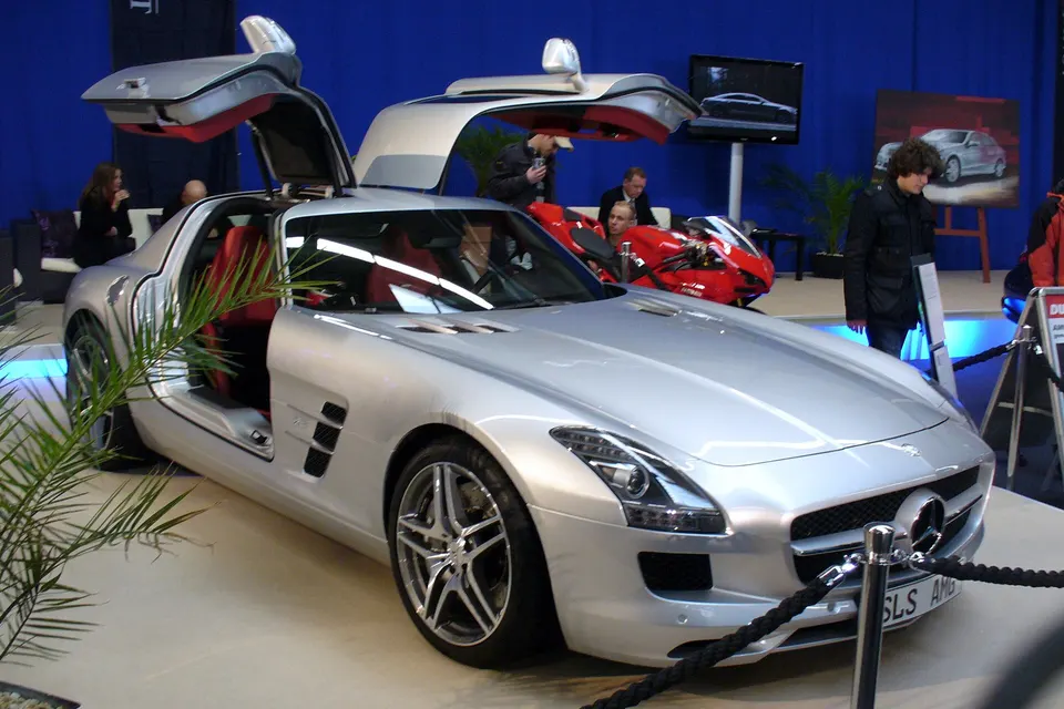 Red Mercedes-Benz SLS AMG gullwing coupé, front three-quarter view