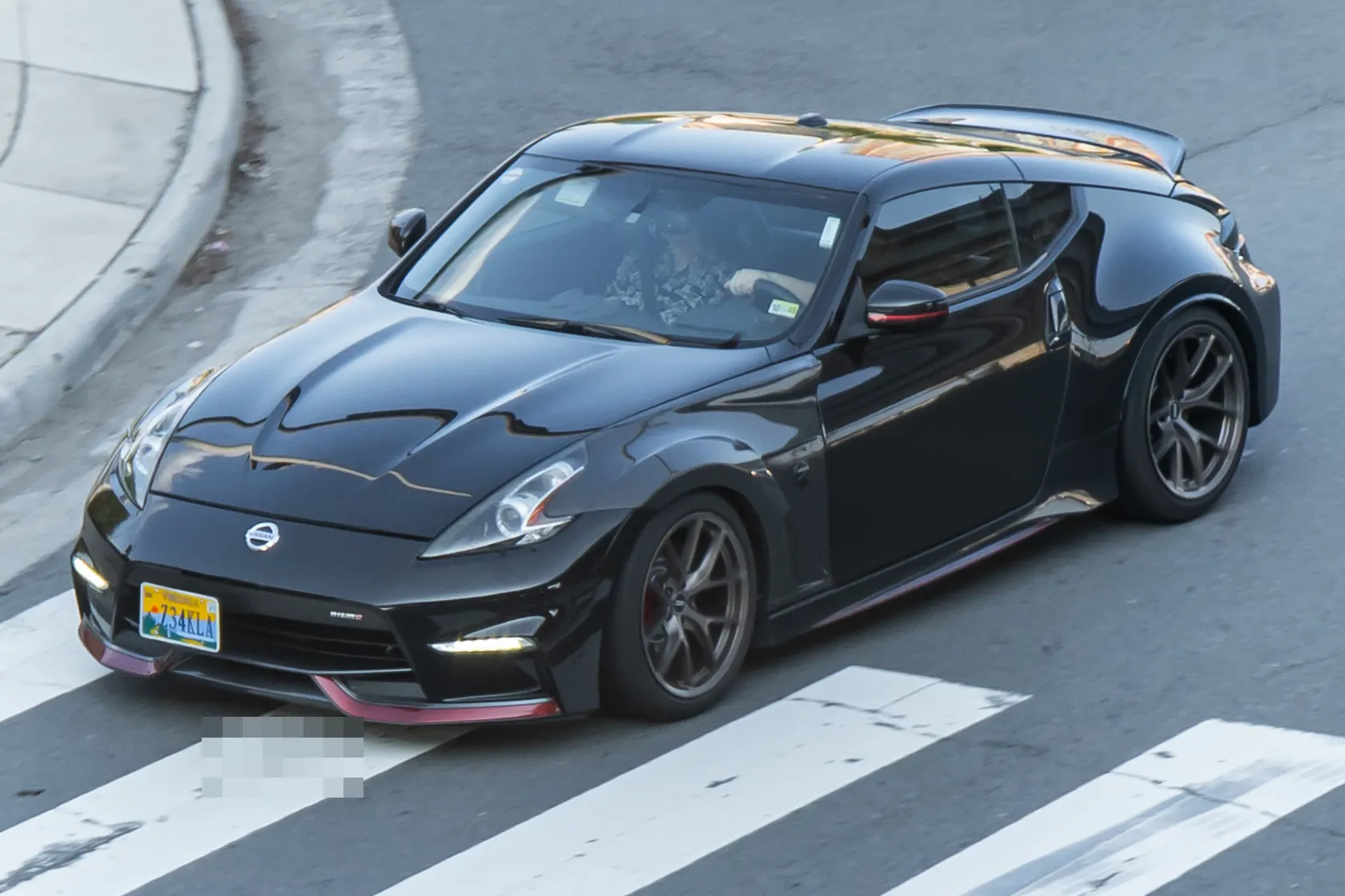 White Nissan 370Z Nismo Z34 in front three-quarter view