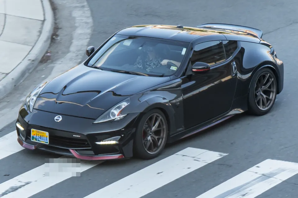 White Nissan 370Z Nismo Z34 in front three-quarter view