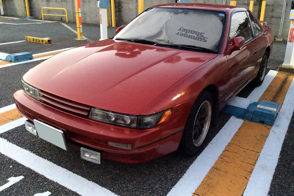 White Nissan Silvia K's S13 in front three-quarter view