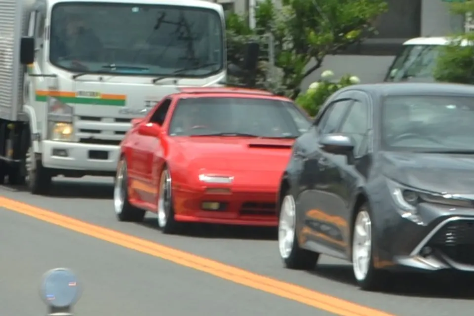 Red 1989 Mazda Savanna RX-7 GT Limited FC3S driving in Japan