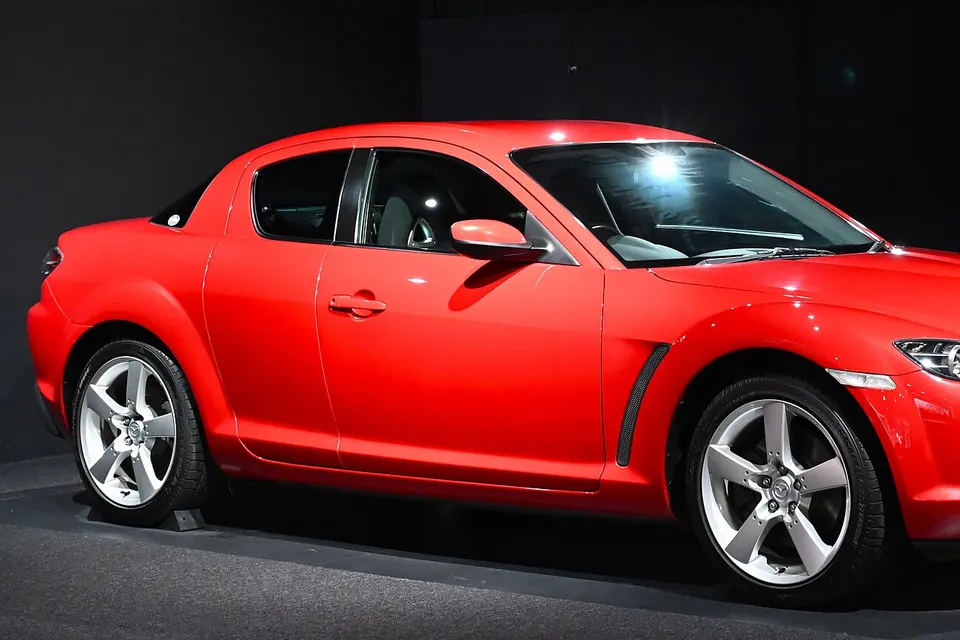 Red 2003 Mazda RX-8 Type S on display at the Mazda Museum