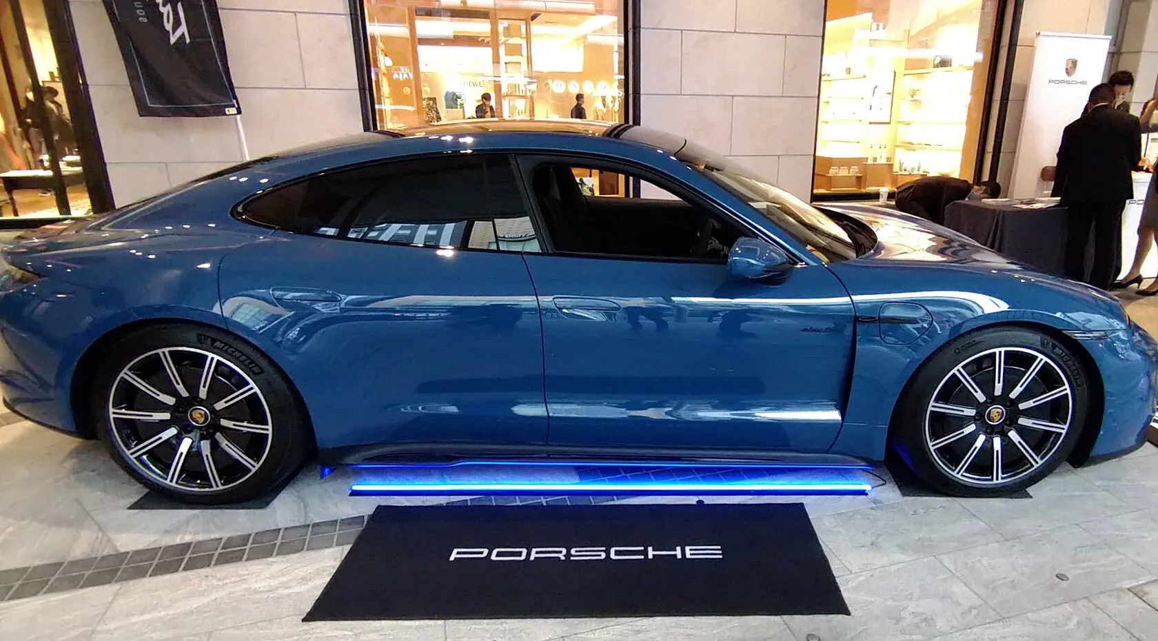 Blue first-generation Porsche Taycan GTS photographed in side profile in Kyoto