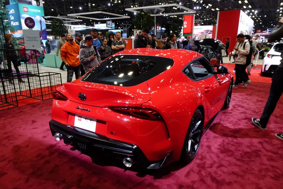 Red Toyota GR Supra 3.0 A90 on display, rear three-quarter view