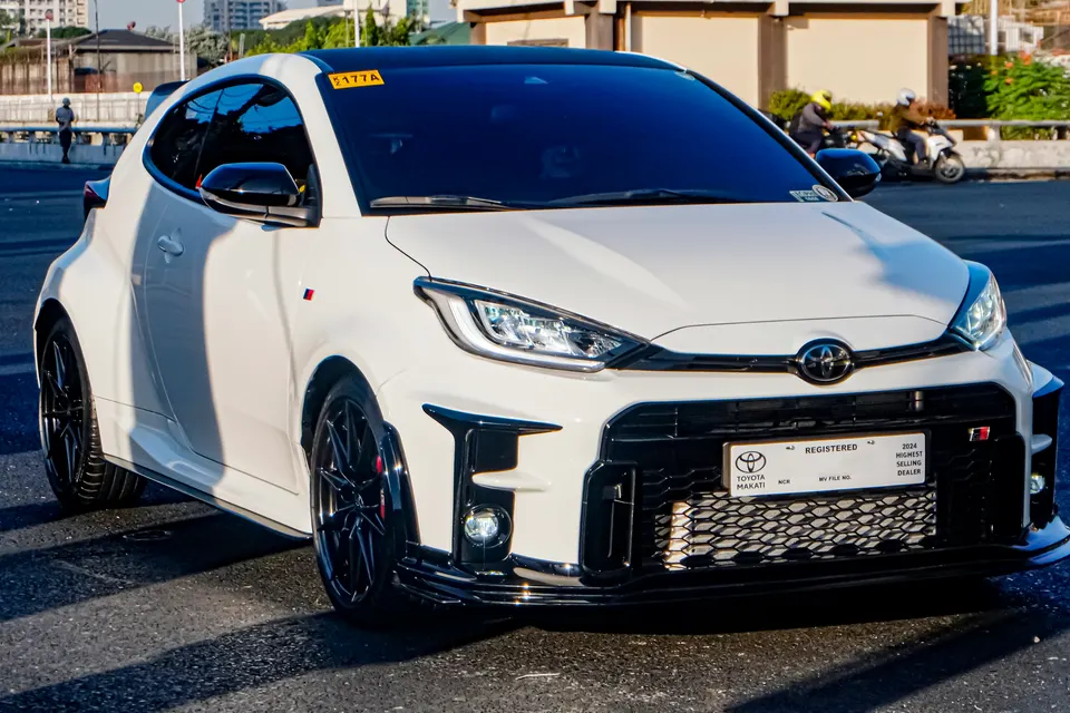 White Toyota GR Yaris GXPA16 from the front three-quarter view