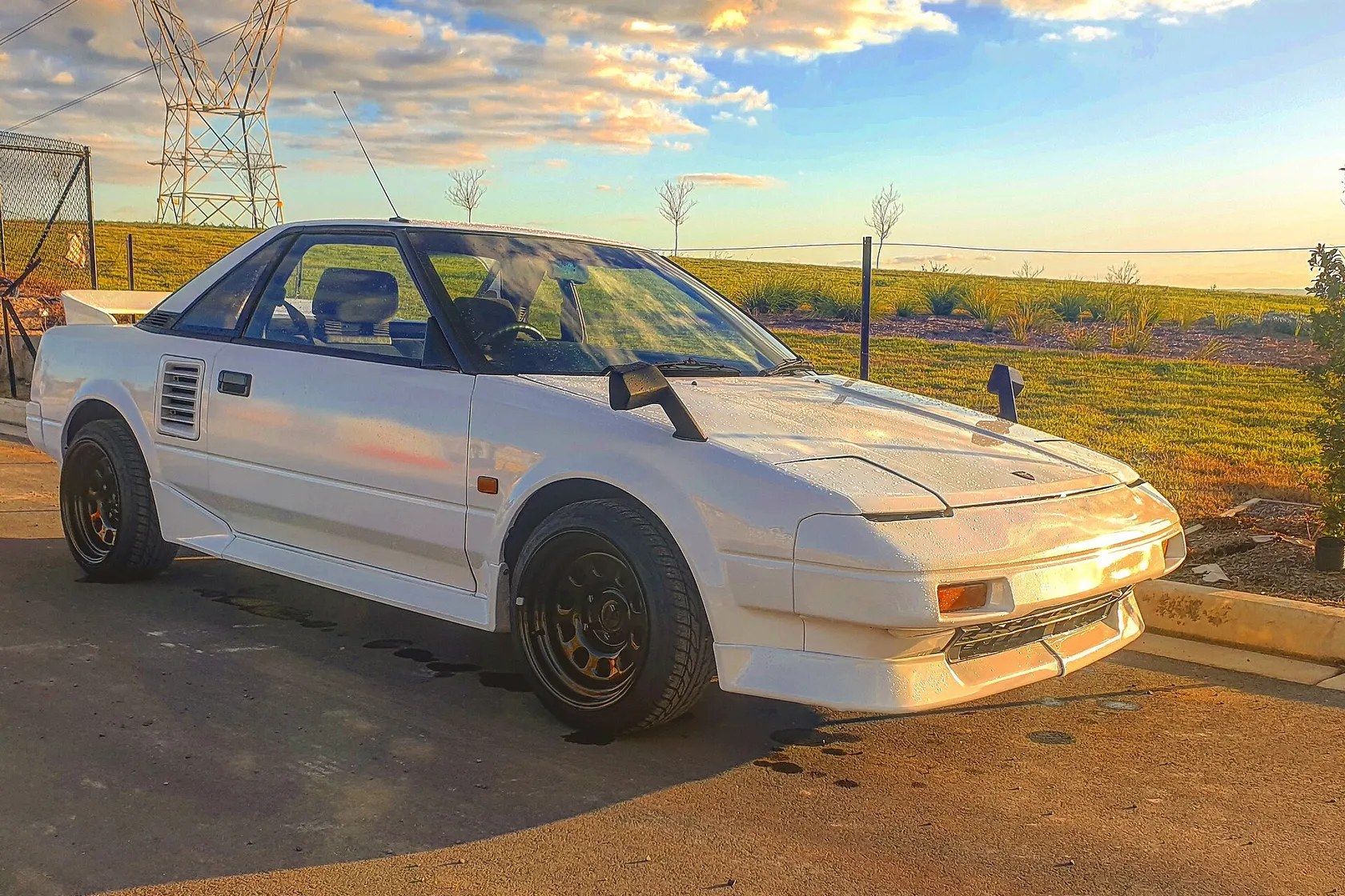 White 1989 Toyota MR2 AW11 Super Charger seen from the front three-quarter view