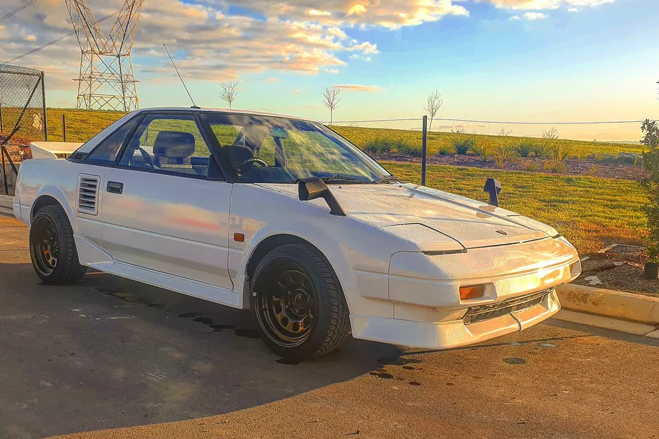 White 1989 Toyota MR2 AW11 Super Charger seen from the front three-quarter view